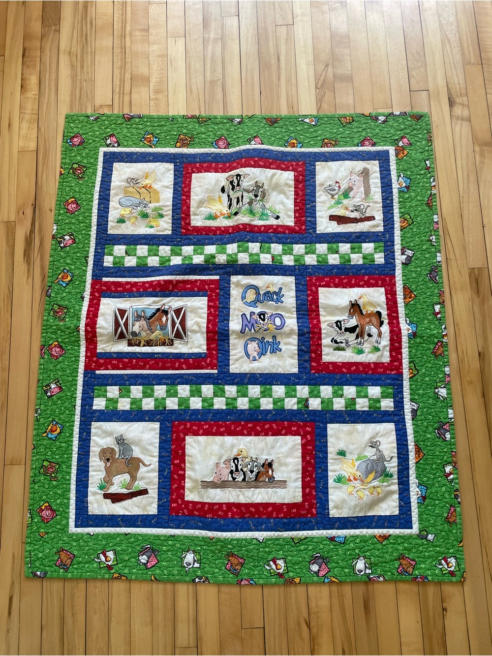 Quack, Moo, Oink quilt with farm animals and 'Quack, Moo, Oink'